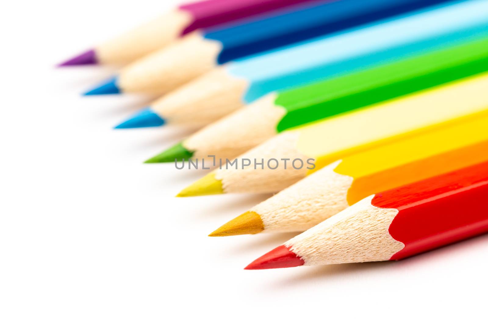 A Colorful color wooden pencils on a white background