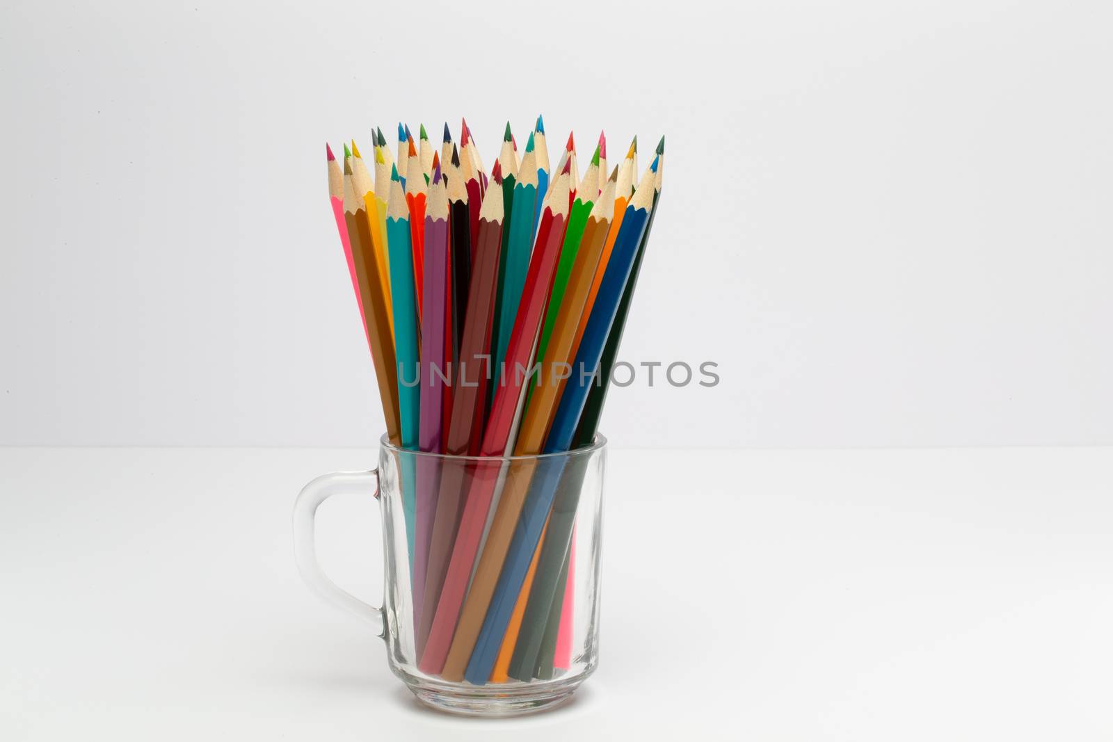 Some colorful wooden pencils on a white background