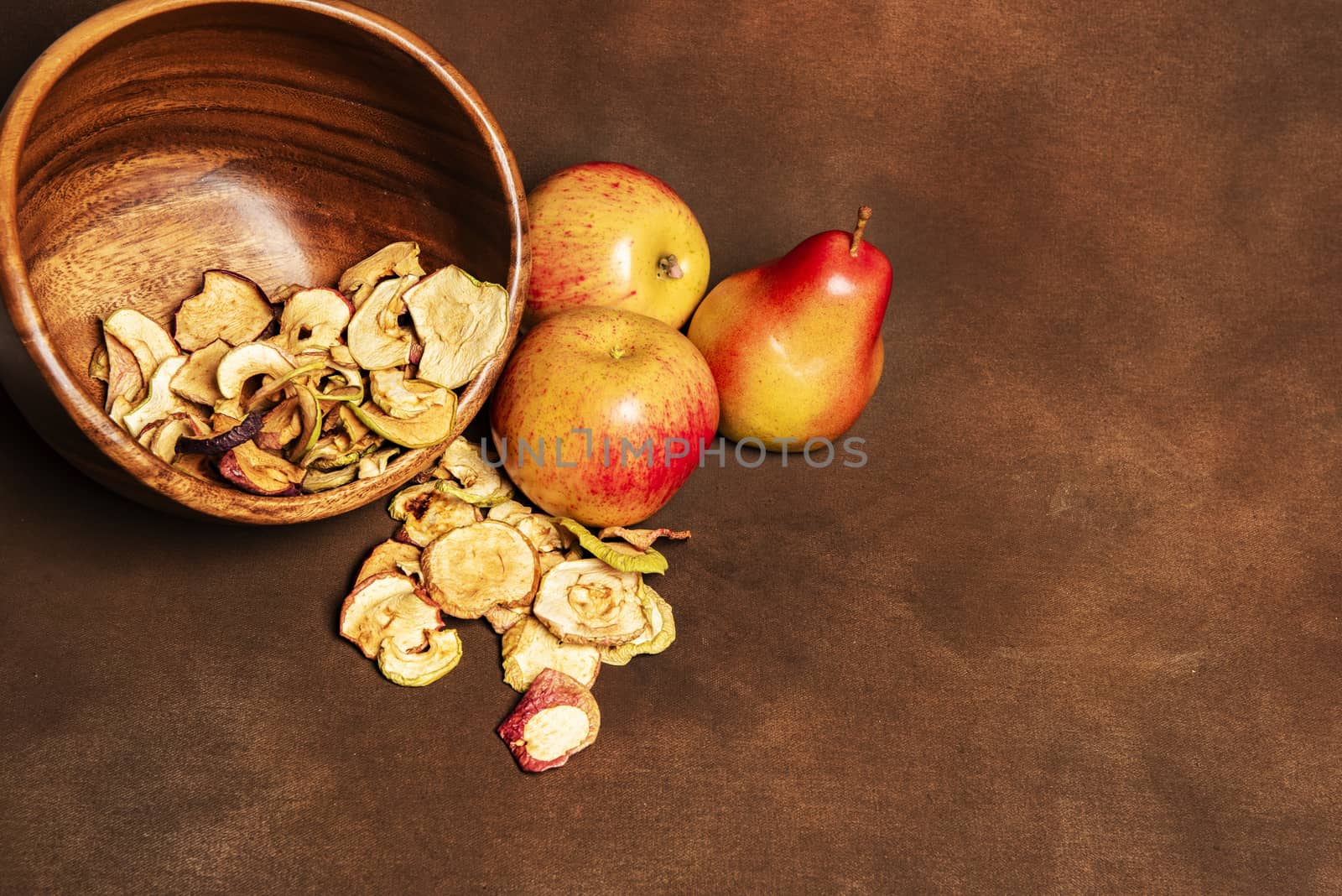 Dried apples and pears on a brown background by fyletto