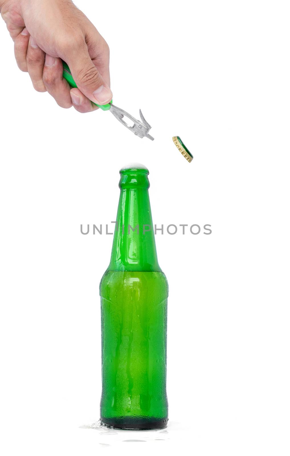 Hands are opening a beer bottle with a device for opening the bottle.