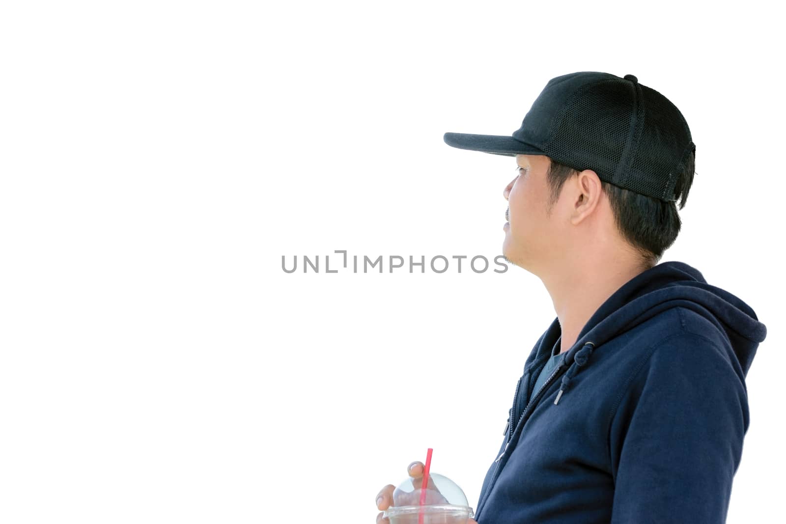 Asian man wearing a blue long sleeve shirt and wearing a hat holding a plastic glass of water isolated on white background.