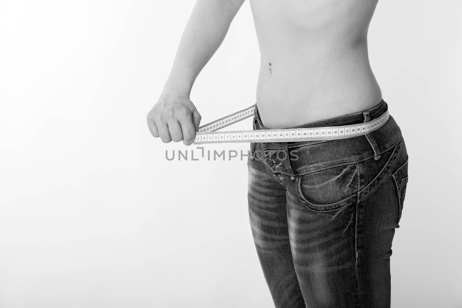 woman in jeans with a tape measure by 25ehaag6