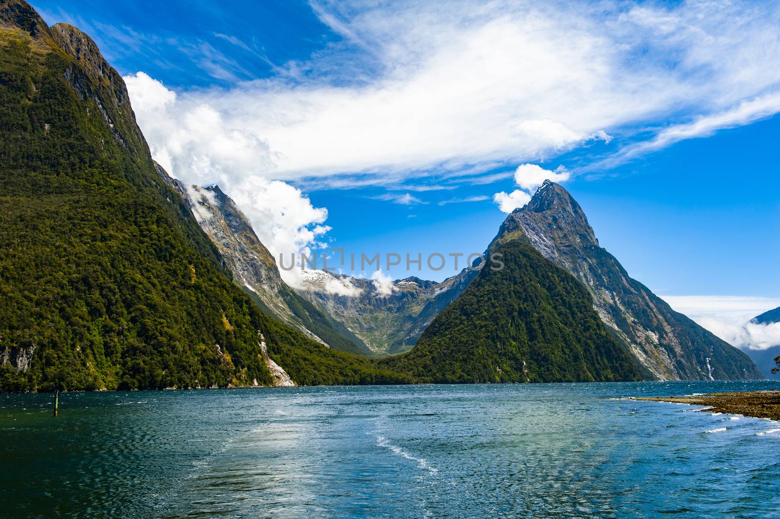 Famous Mitre Peak rising from the Milford Sound fiord. Fiordland national park, New Zealand