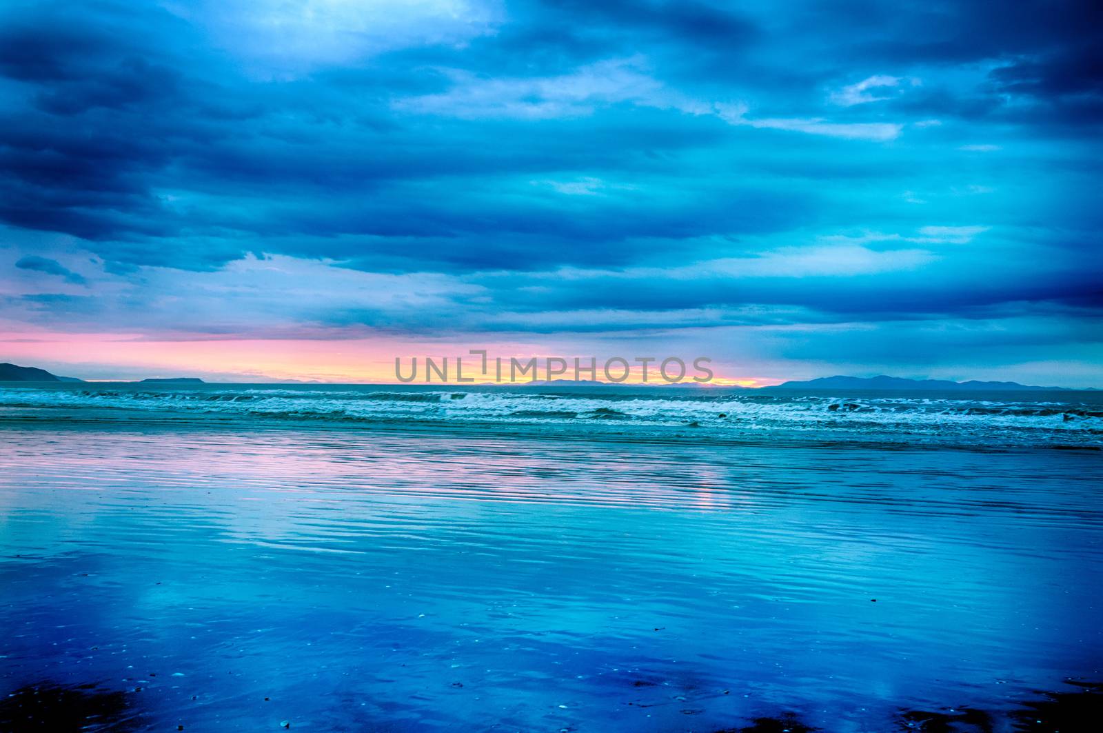 Blue surreal sunset over the sea in the New Zealand