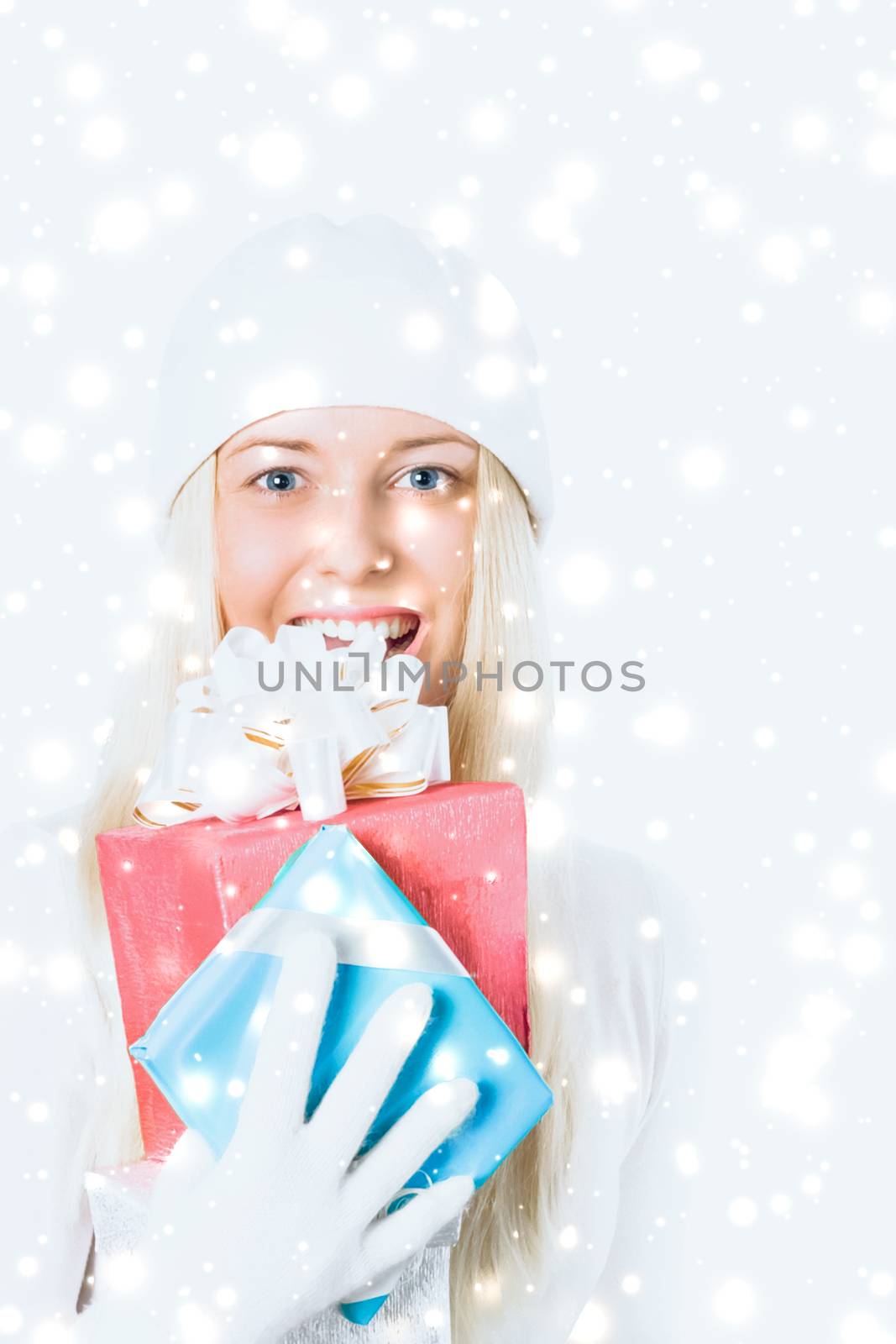 Merry Christmas and glitter snow background, happy blonde girl with gift boxes in winter season for shopping sale and holiday brands