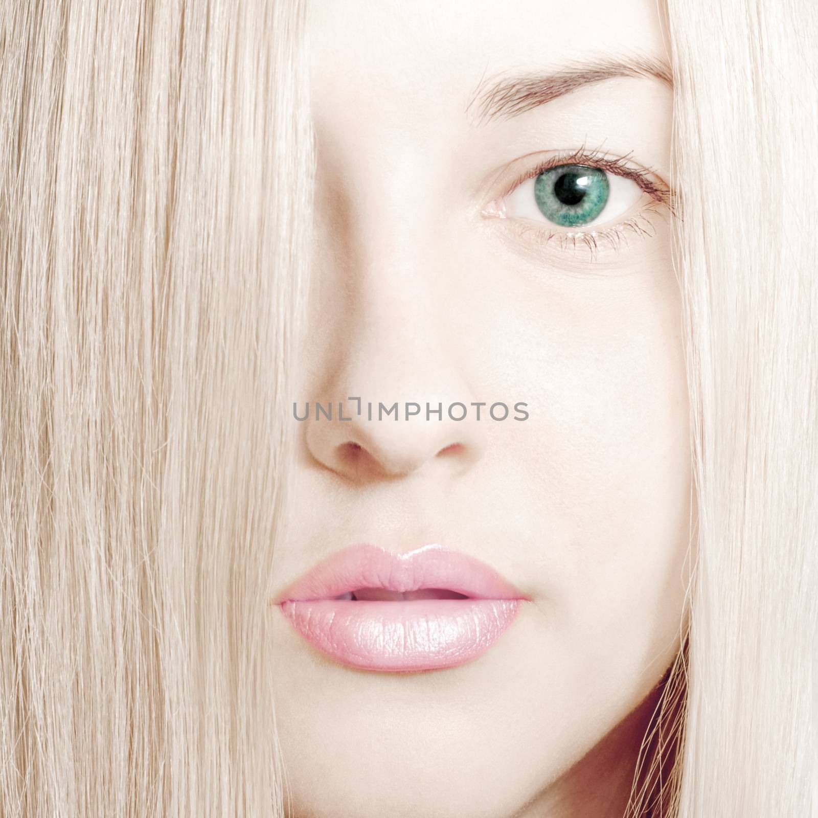 Beauty face close-up of young woman, blonde hair and chic make-u by Anneleven
