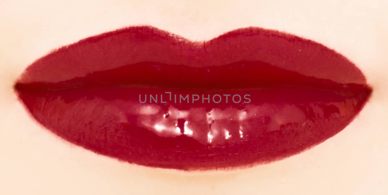 Female lips with glossy lipstick or lip gloss for make-up and be by Anneleven