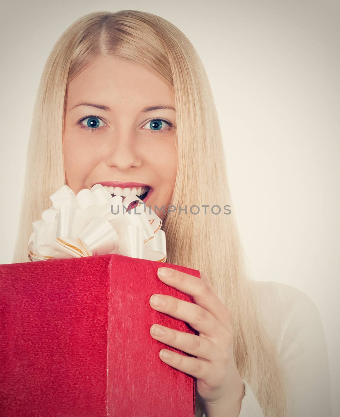 Blonde girl with gift boxes in Christmas, woman and presents in winter season for shopping sale and holiday brands