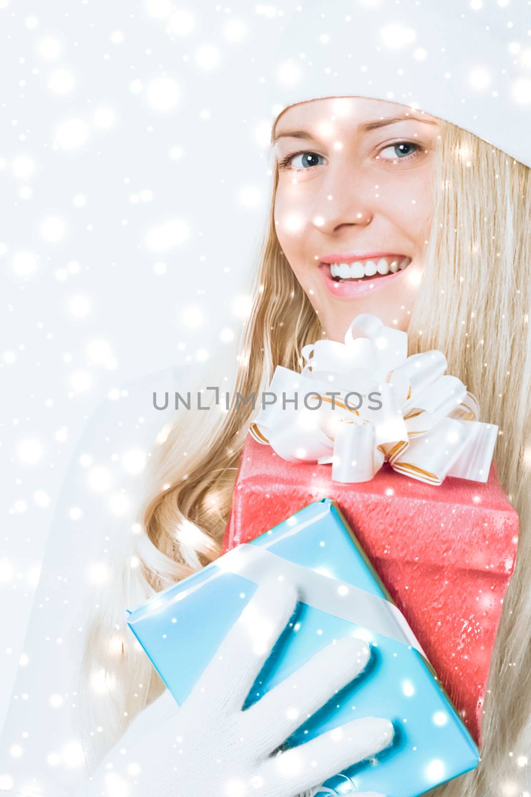 Merry Christmas and glitter snow background, happy blonde girl with gift boxes in winter season for shopping sale and holiday brands