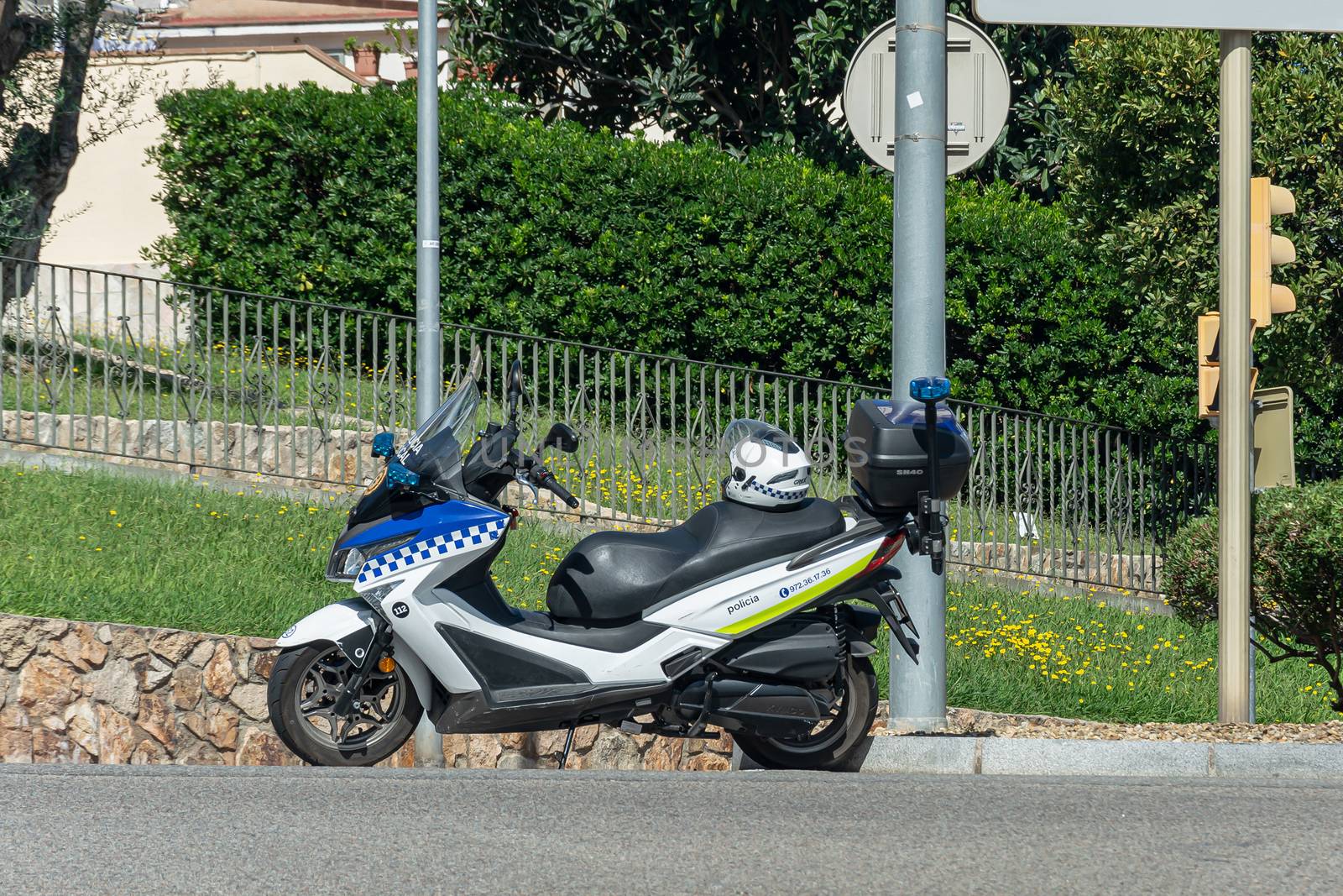 Lloret De Mar, Spain - 10/04/2019: police motorcycle at the intersection of a city street. Stock photo.