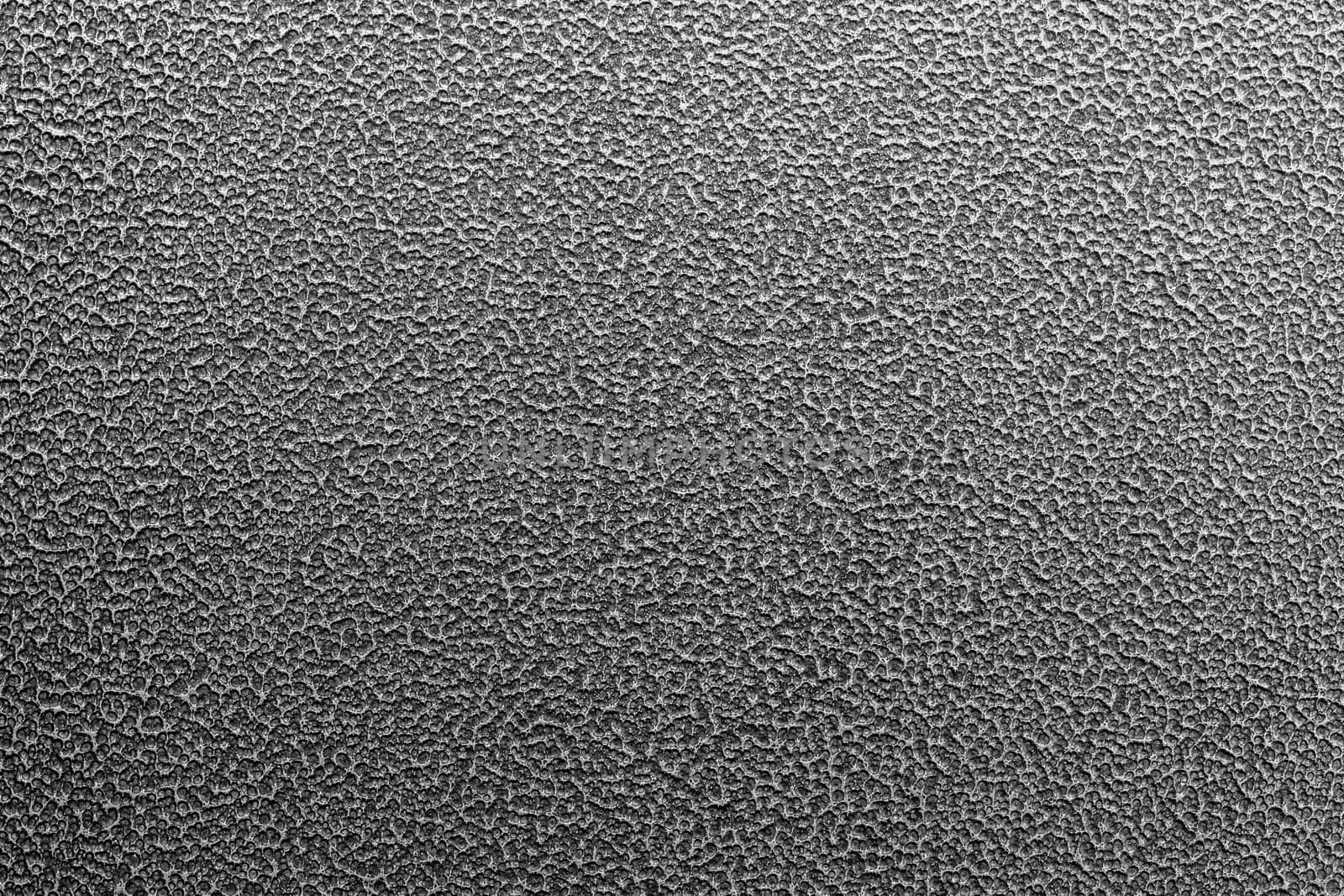 Texture and full frame background of hammered powder paint coating on flat sheet steel surface. Also known as hammertone effect.