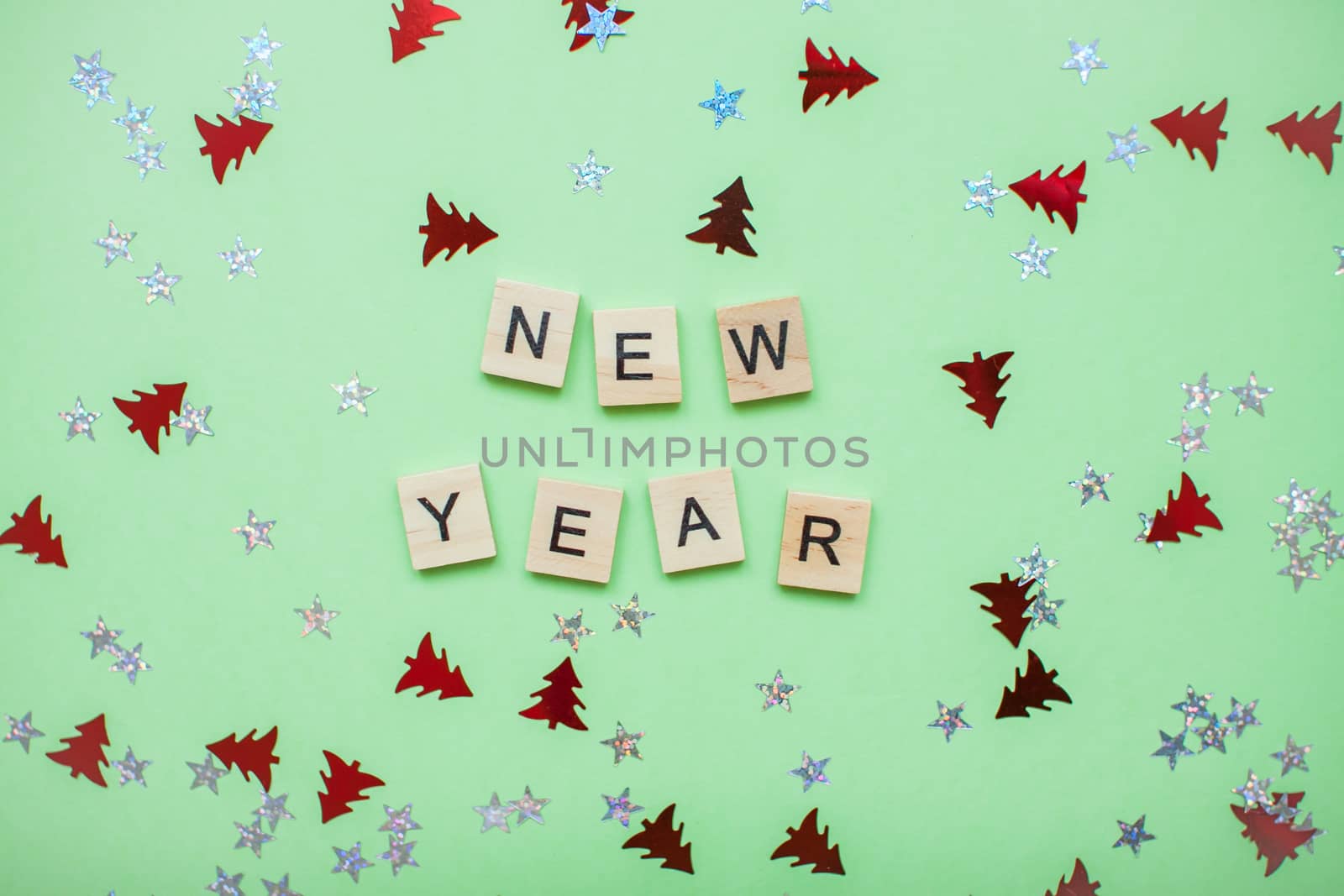 inscription from wooden blocks new year on a medical protective mask and on a new year background