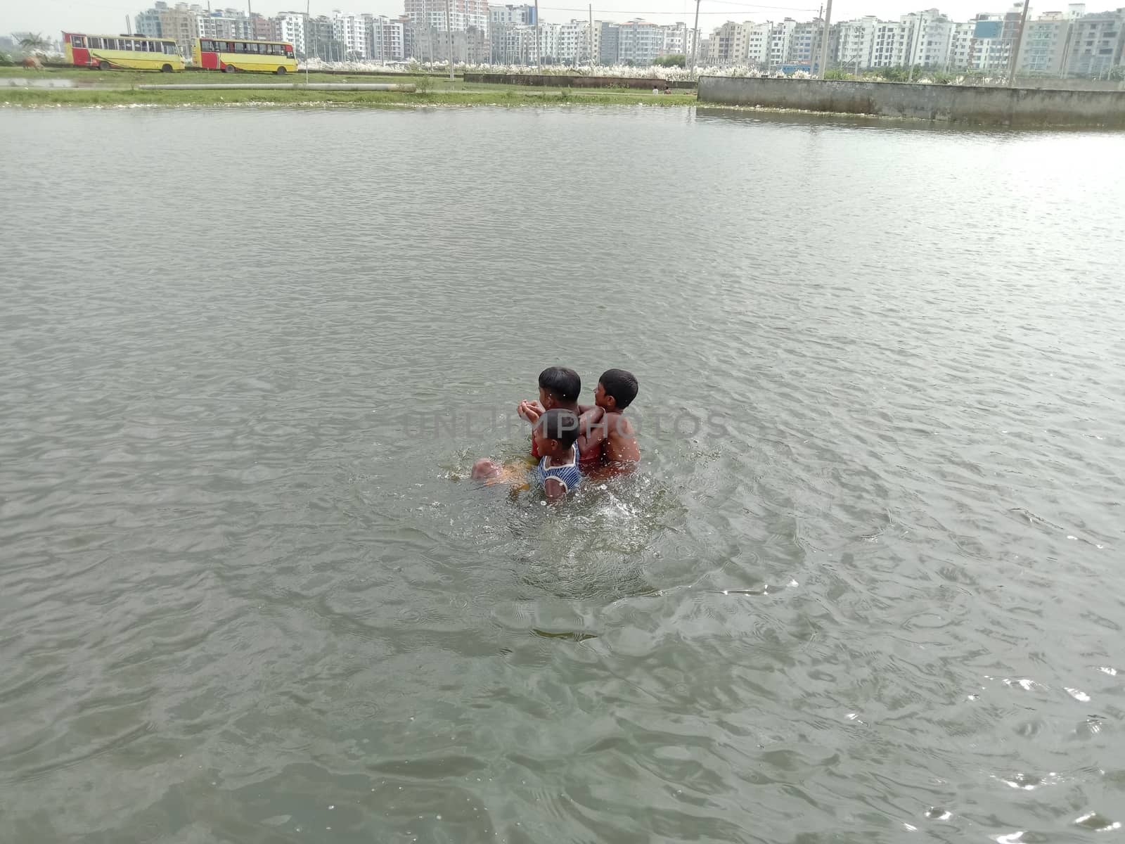 Childs swimming on lake with happiness