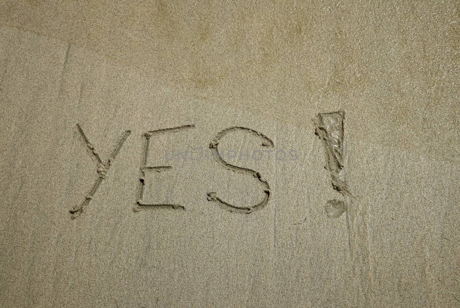 YES concept, positive changes in the life, word written on sand beach.