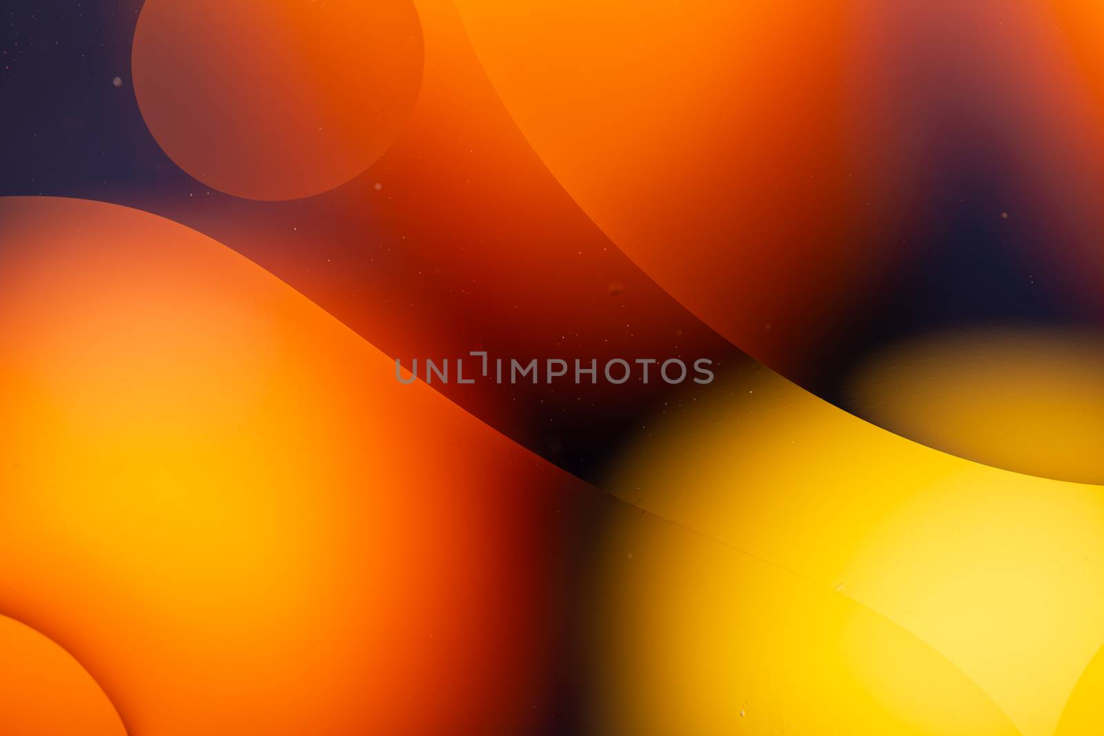 a Close-up water and oil abstract in a rainbow lighting effect