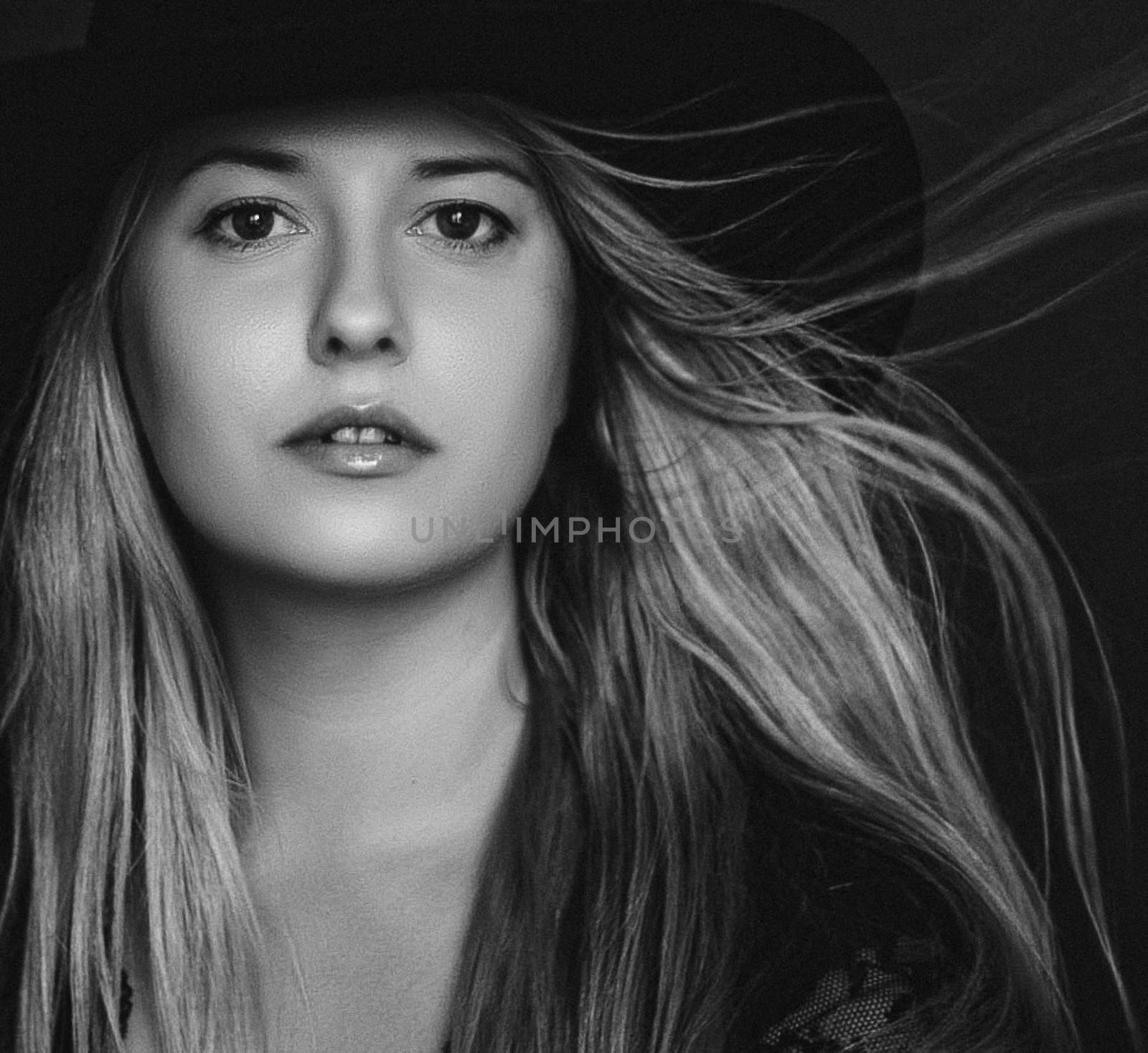 Beautiful blonde woman wearing a hat, artistic film portrait in  by Anneleven