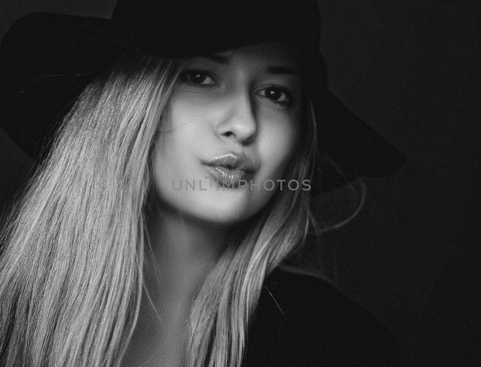 Beautiful blonde woman wearing a hat, artistic film portrait in  by Anneleven