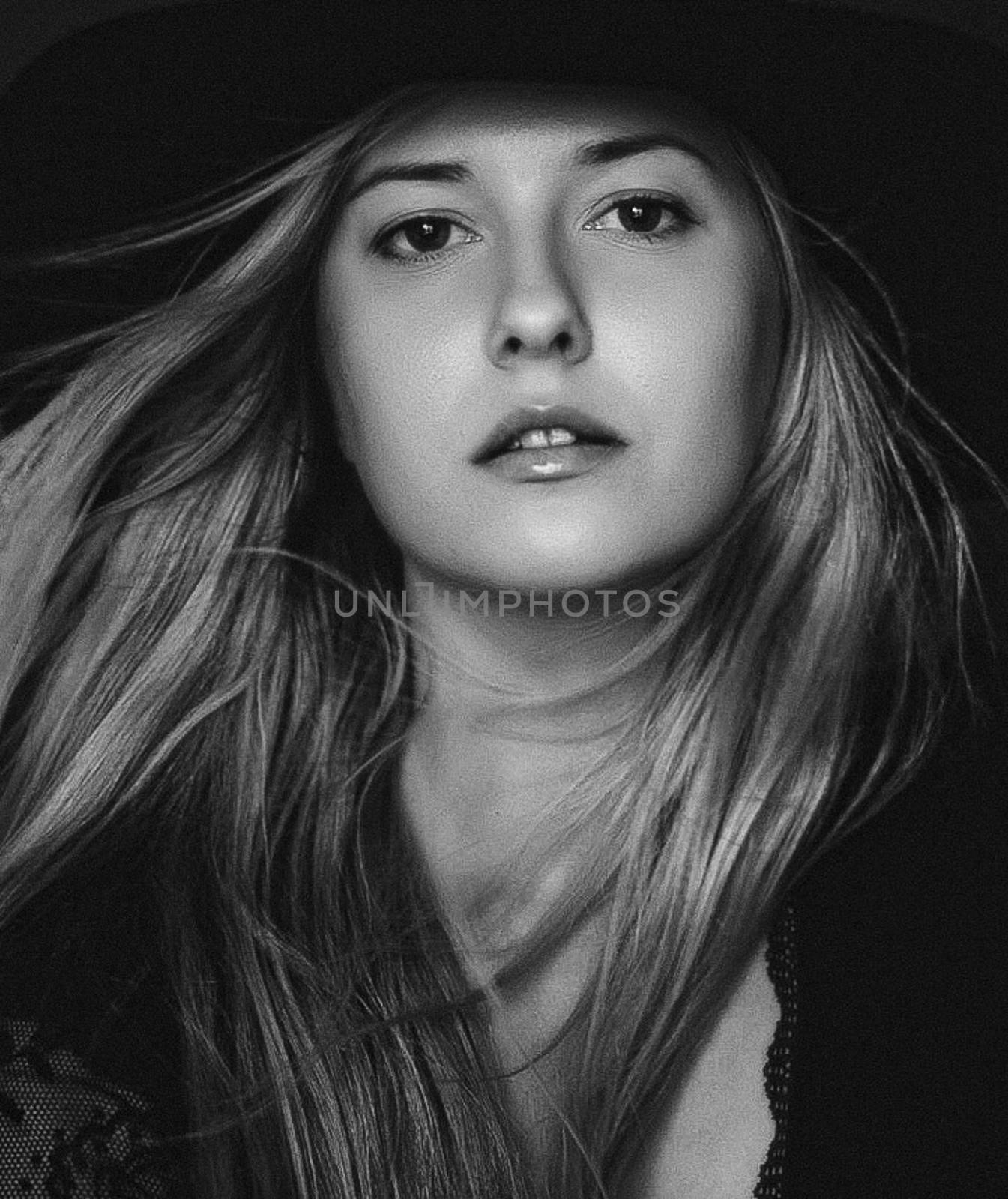 Beautiful blonde woman wearing a hat, artistic film portrait in  by Anneleven