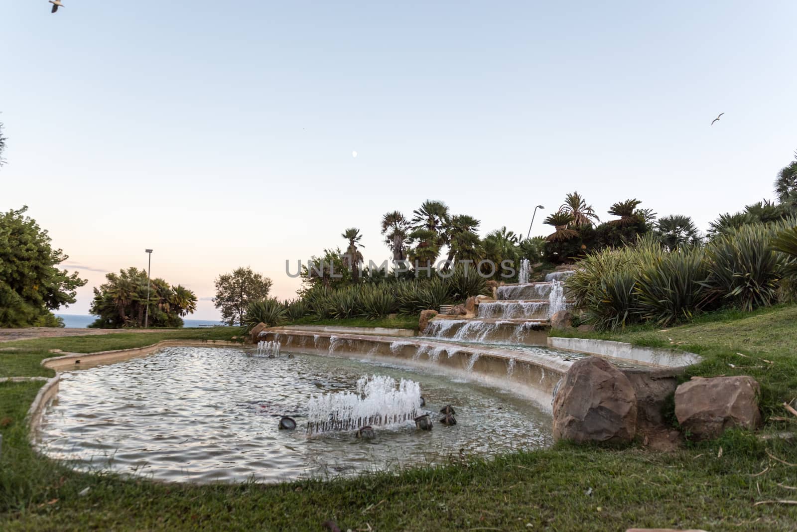 BARCELONA, SPAIN - september 26, 2020: It is a cascade fountain in the Jardins del Mirador Park on Mount Montjuic.
