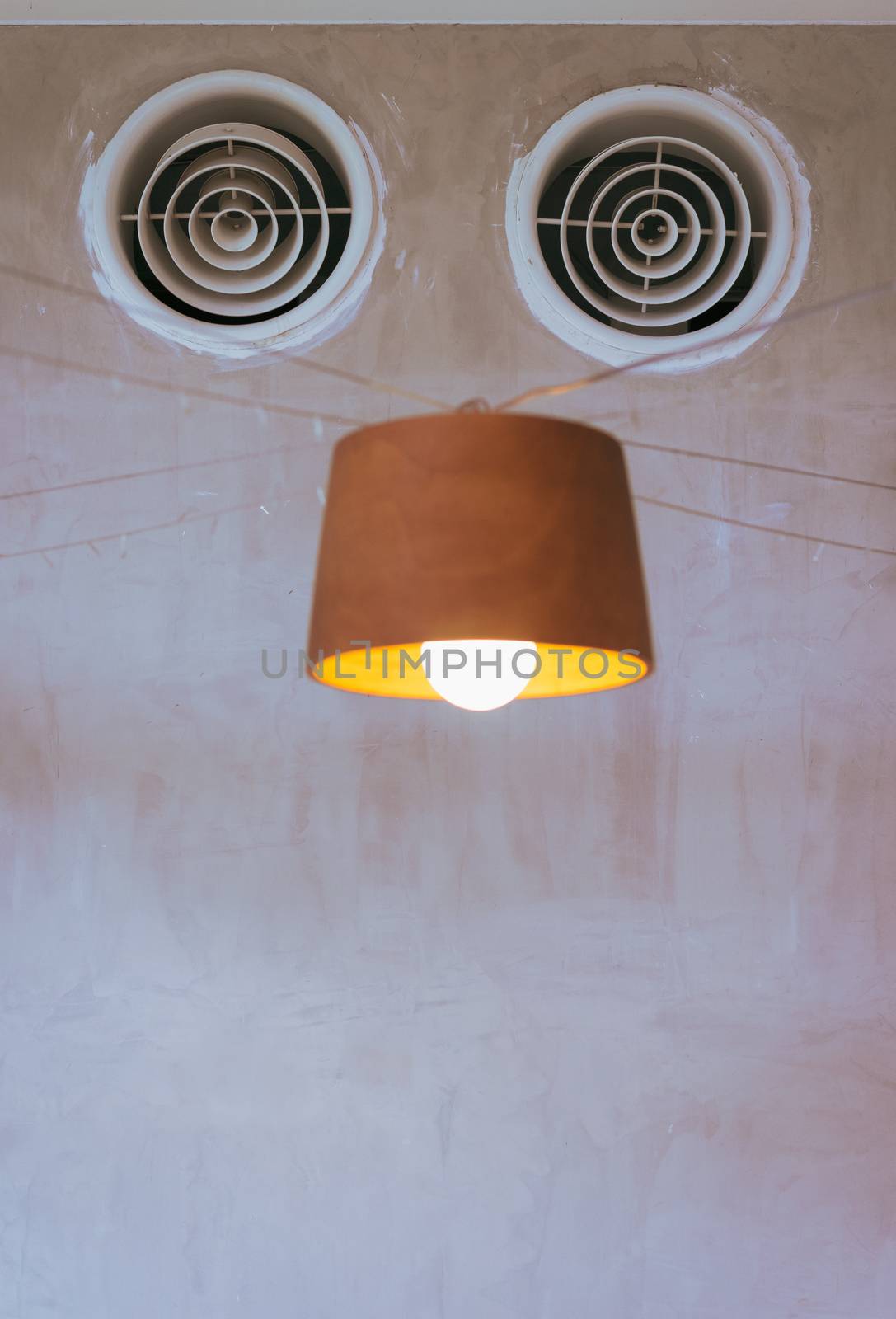 air ventilation on the wall and lamp look like robot