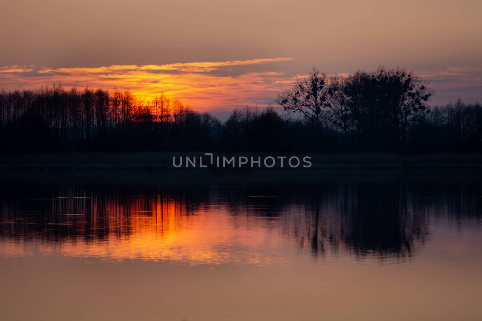 Beautiful sunset on Lake Stankow in Poland, spring evening view