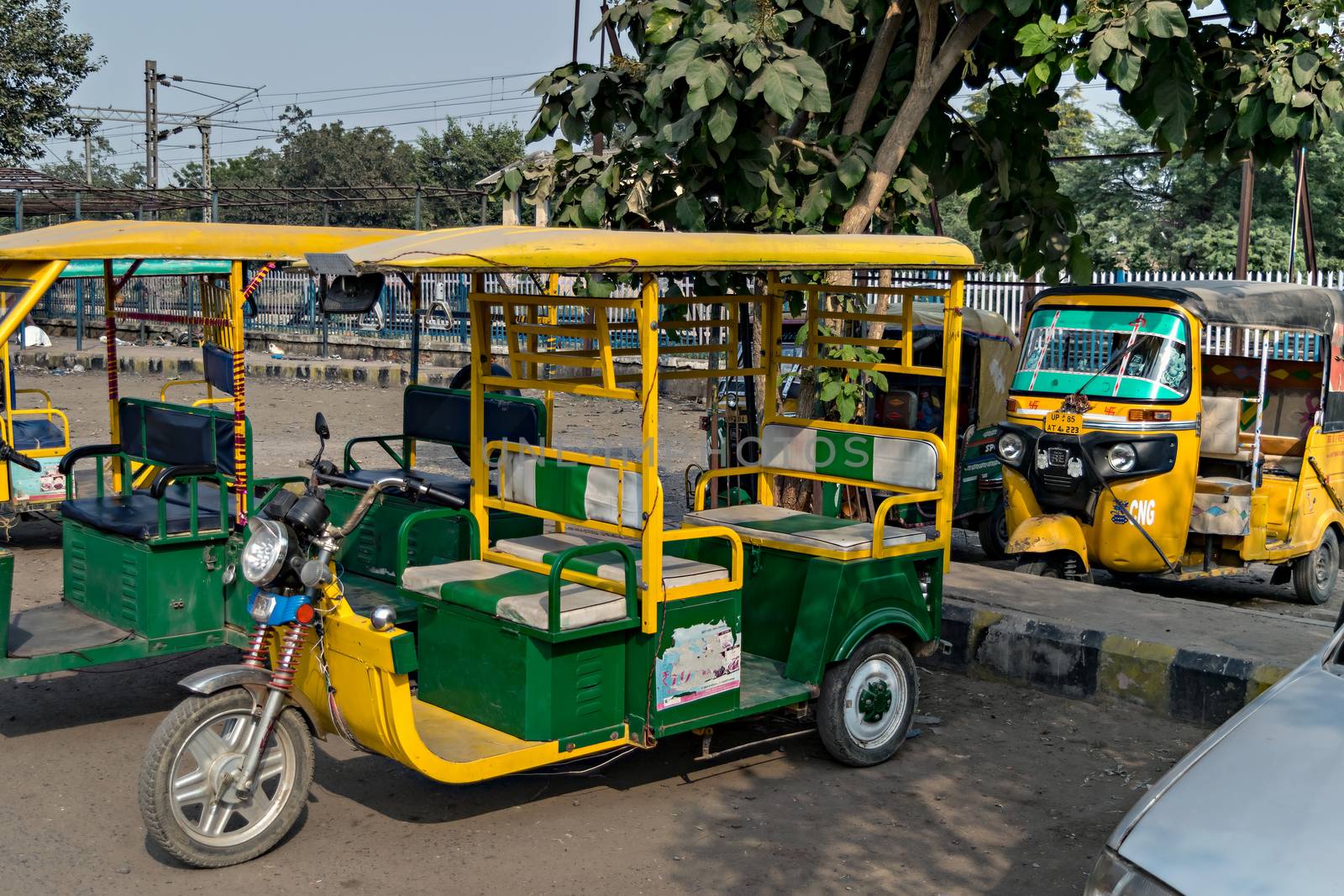Mathura,Uttar Pradesh,India-November 4th,2016:Recent Electric battery operated & old gas operated three wheeler auto rikshaw waiting for passengers near railway station..