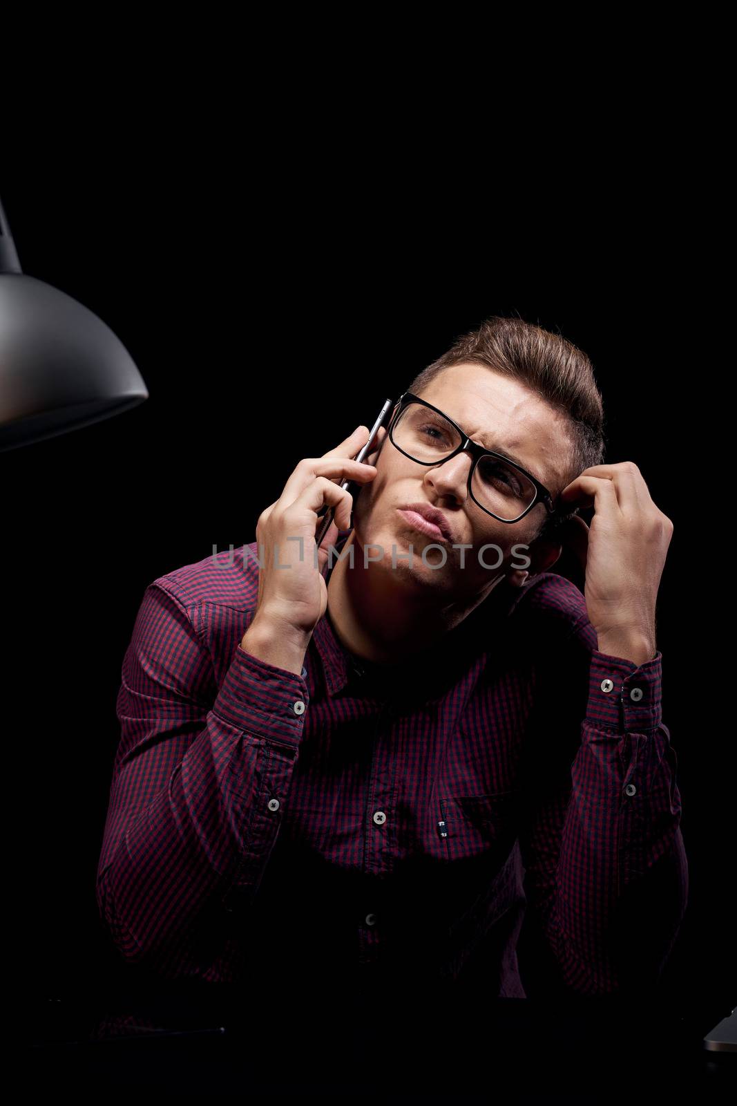 Male manager indoors dark background communication red shirt model glasses new technologies business finance by SHOTPRIME