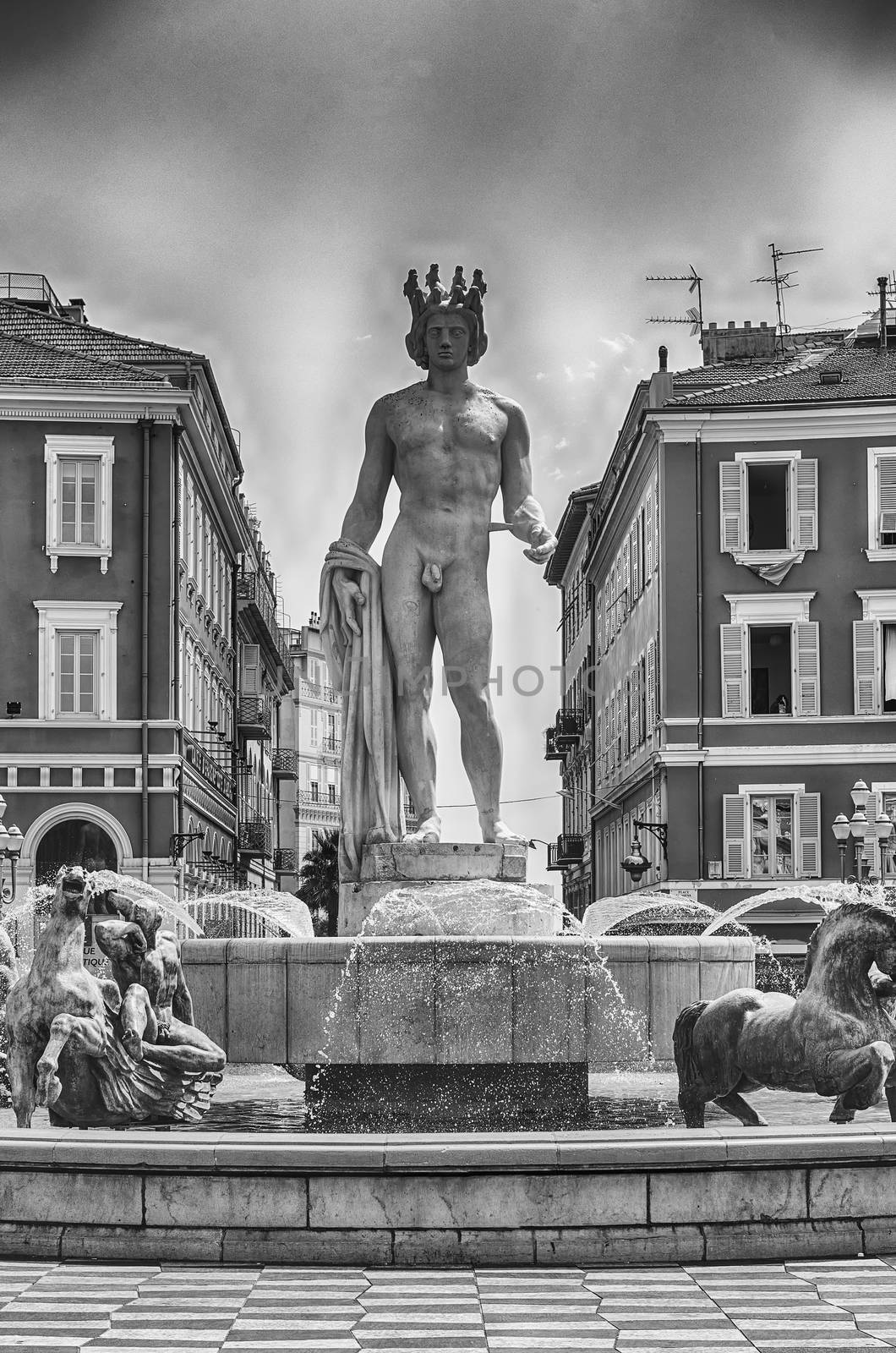 The scenic Fontaine du Soleil with the statue of Apollo in Place Massena, major landmark in Nice, Cote d'Azur, France