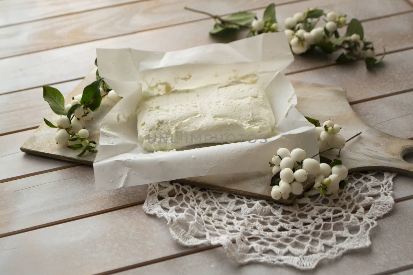 natural cottage cheese on a white shabby table