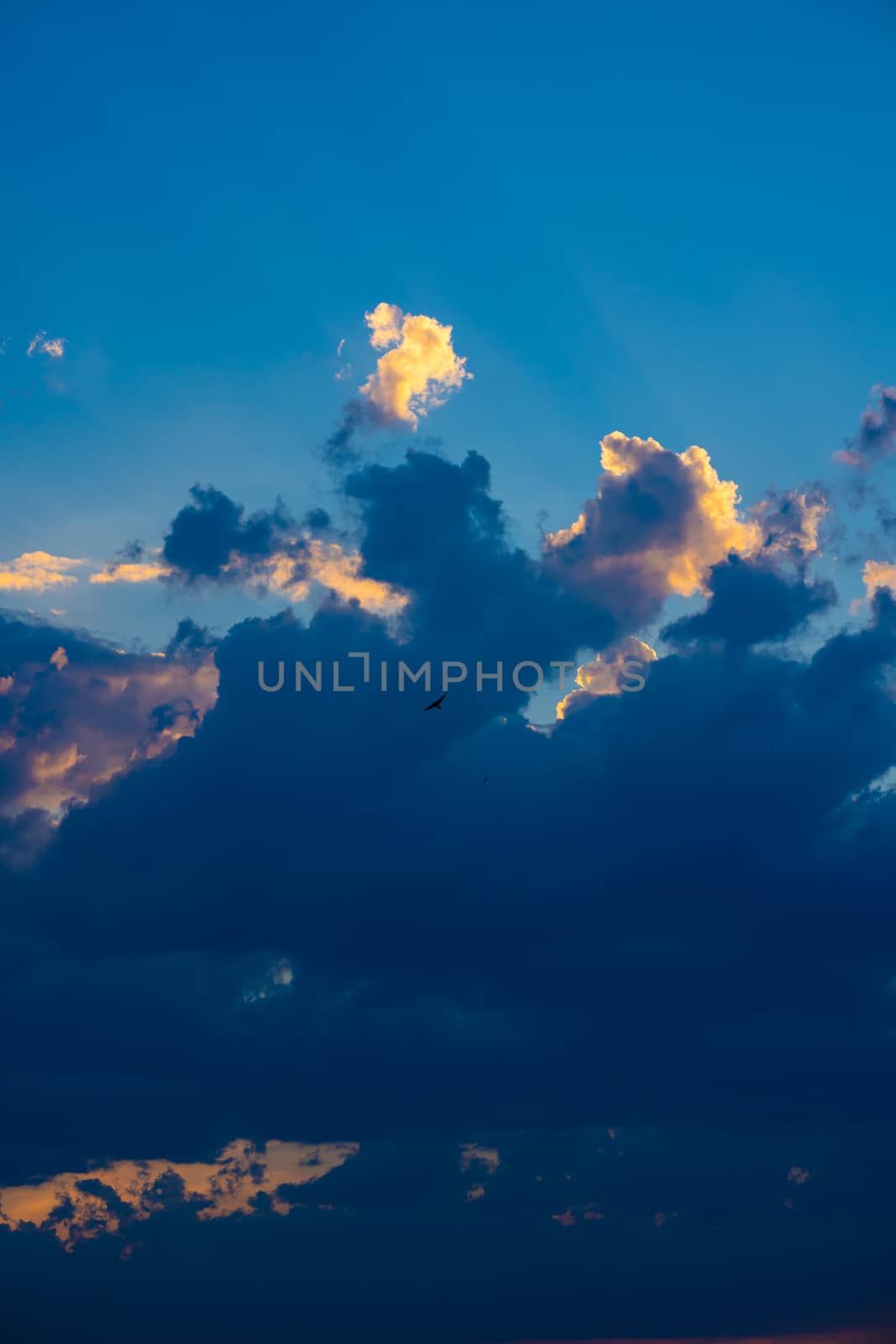 Heavy cloudy sky at sunset. A landscape of beautiful nature.