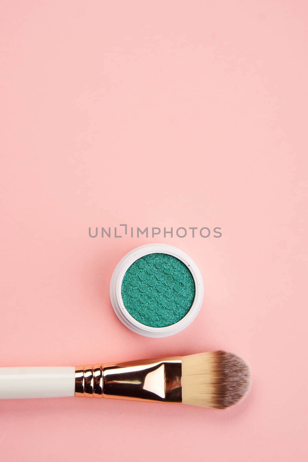 eyeshadow makeup brushes collection professional cosmetics accessories on pink background. High quality photo