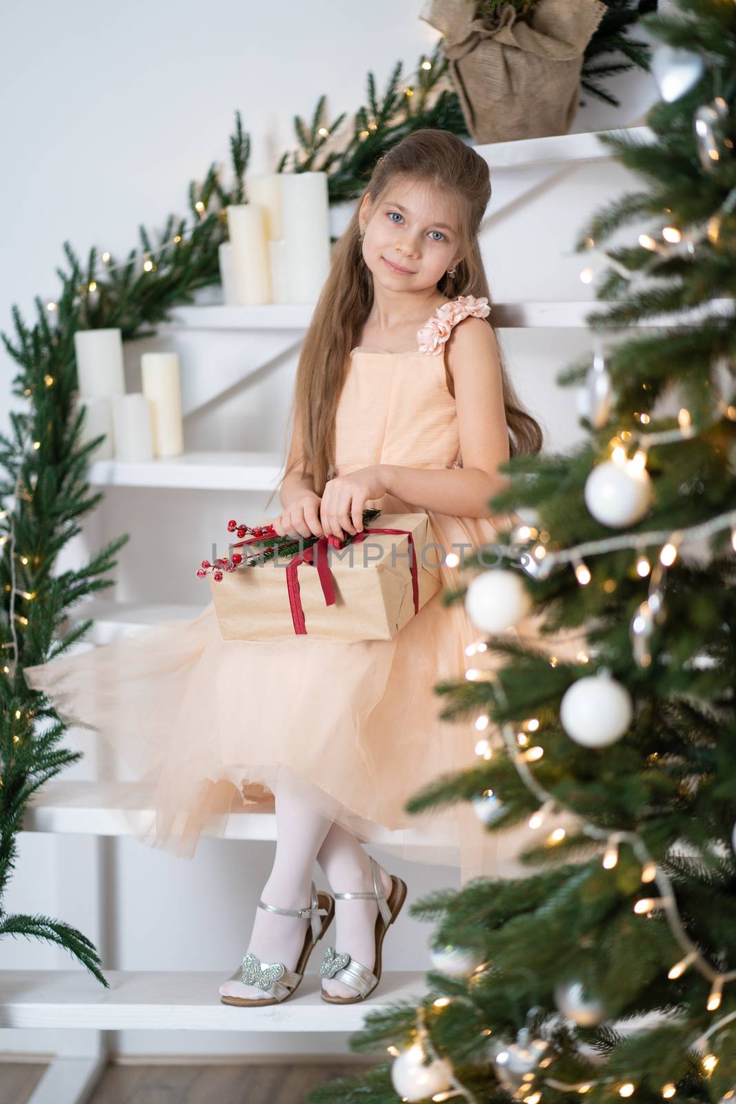 Little girl in princess dress celebrates christmas. Christmas magic fairy tale. Happy childhood.