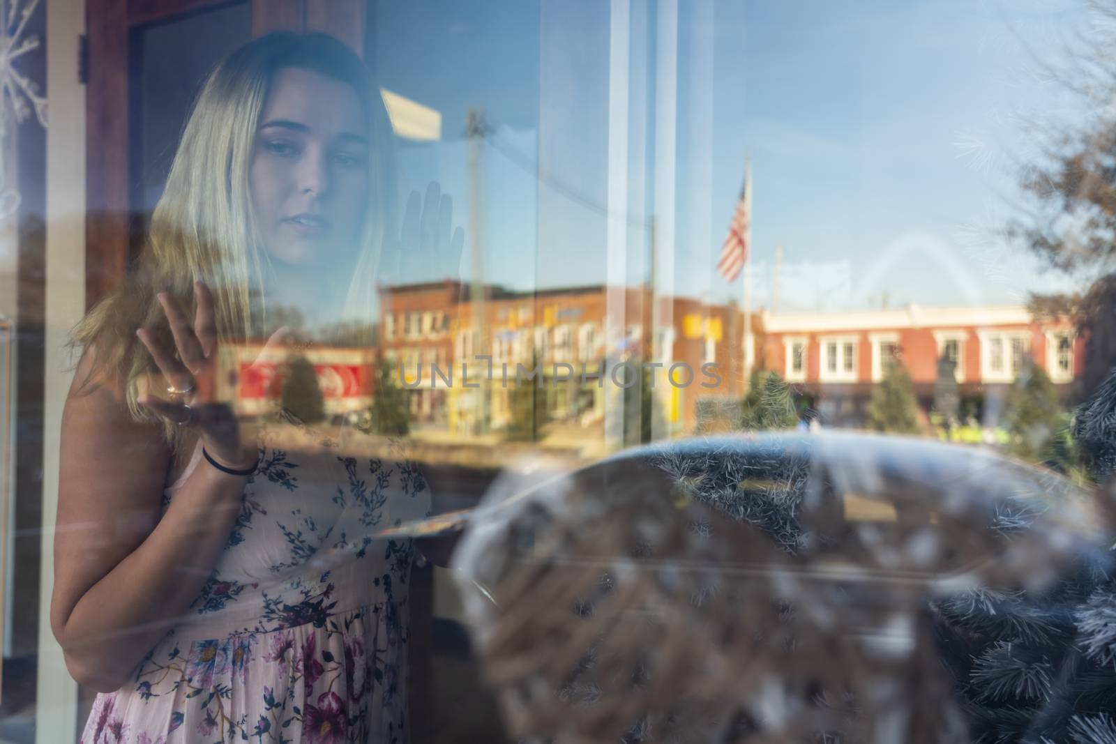 A gorgeous blonde model enjoys a summers day outdoors in a small town