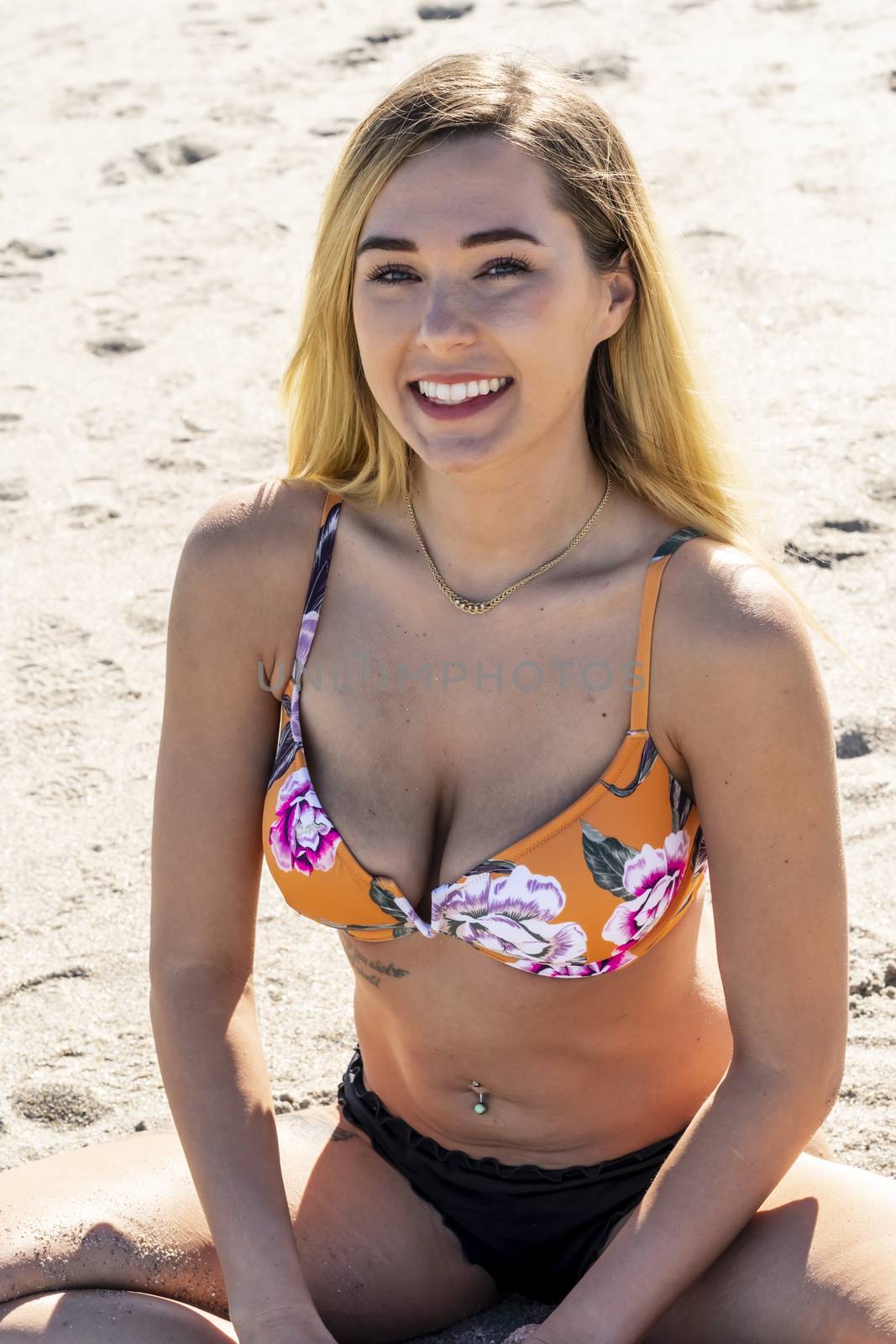 A gorgeous bikini model posing in a beach environment