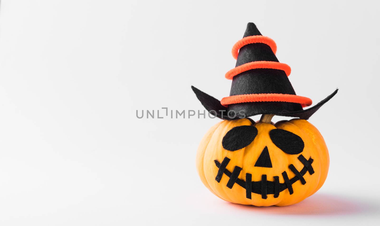 Funny Halloween day party concept ghost pumpkin head jack lantern scary smile wear hat, studio shot isolated on white background, Holiday decoration
