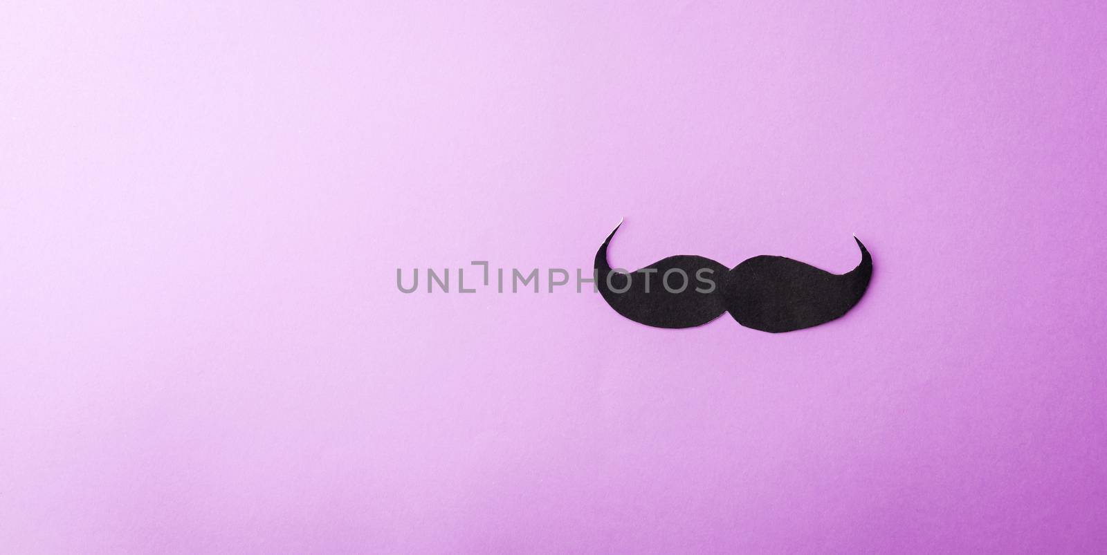 Black mustache paper on purple by Sorapop