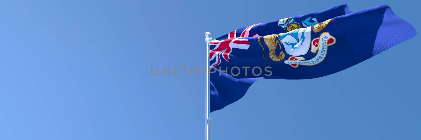 3D rendering of the national flag of Tristan da Cunha waving in the wind against a blue sky