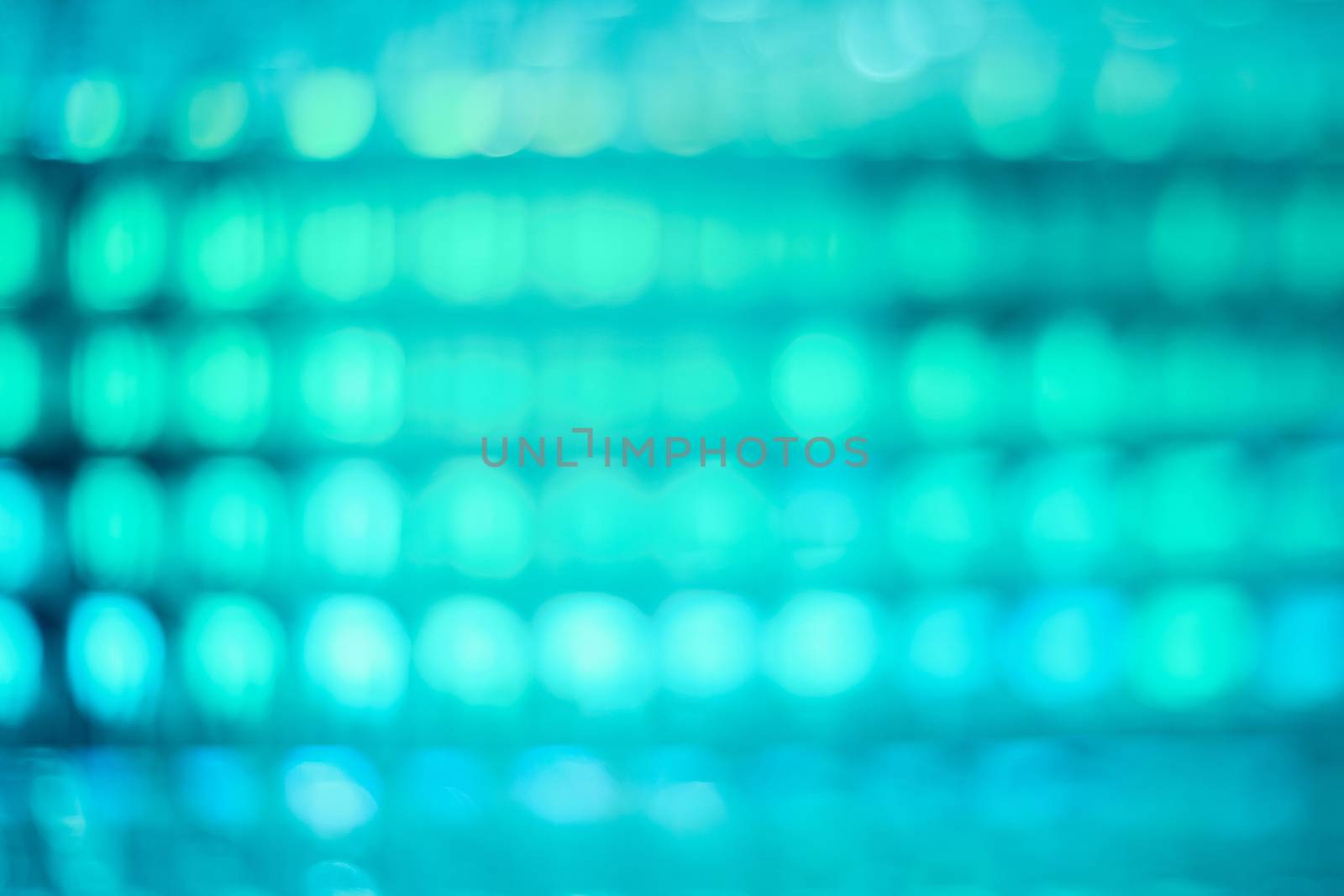 abstract defocused background of stadium or discotheque lights, colorful bokeh of lighting decoration