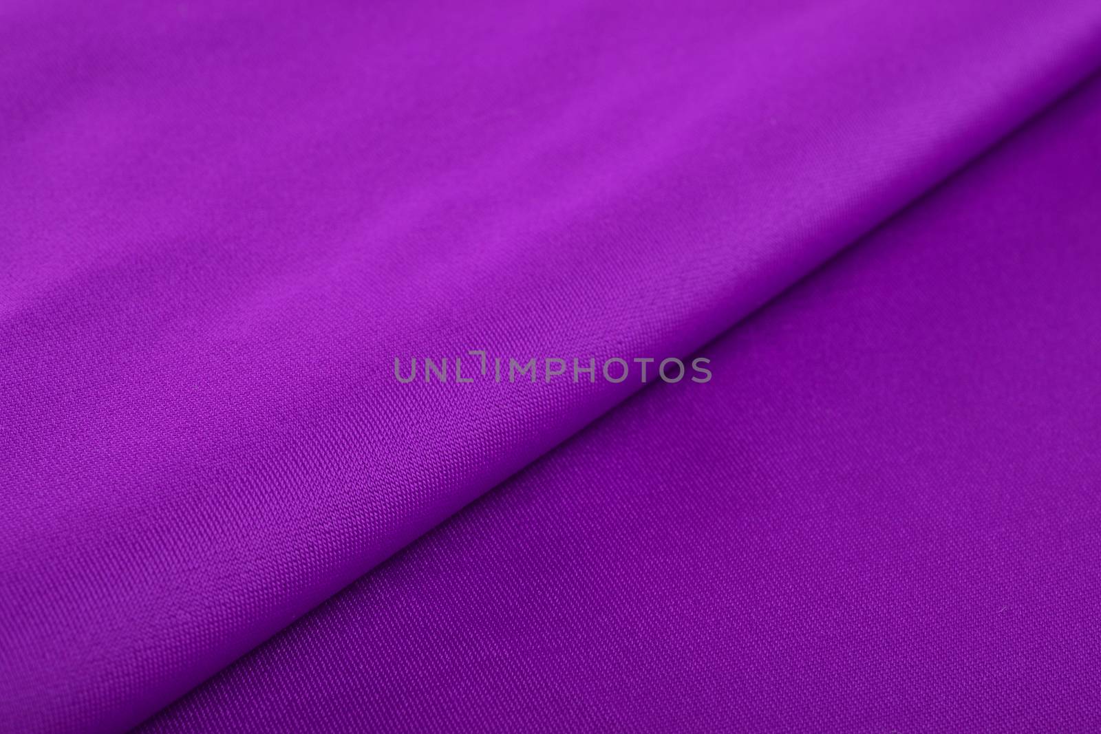 purple Knitted elastic fabric, weaving of threads texture, crumpled fold. For underwear, sports clothes and swimwear. Space for text.