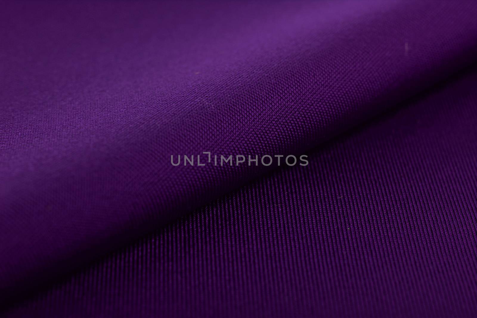 purple Knitted elastic fabric, weaving of threads texture, crumpled fold. For underwear, sports clothes and swimwear. Space for text.