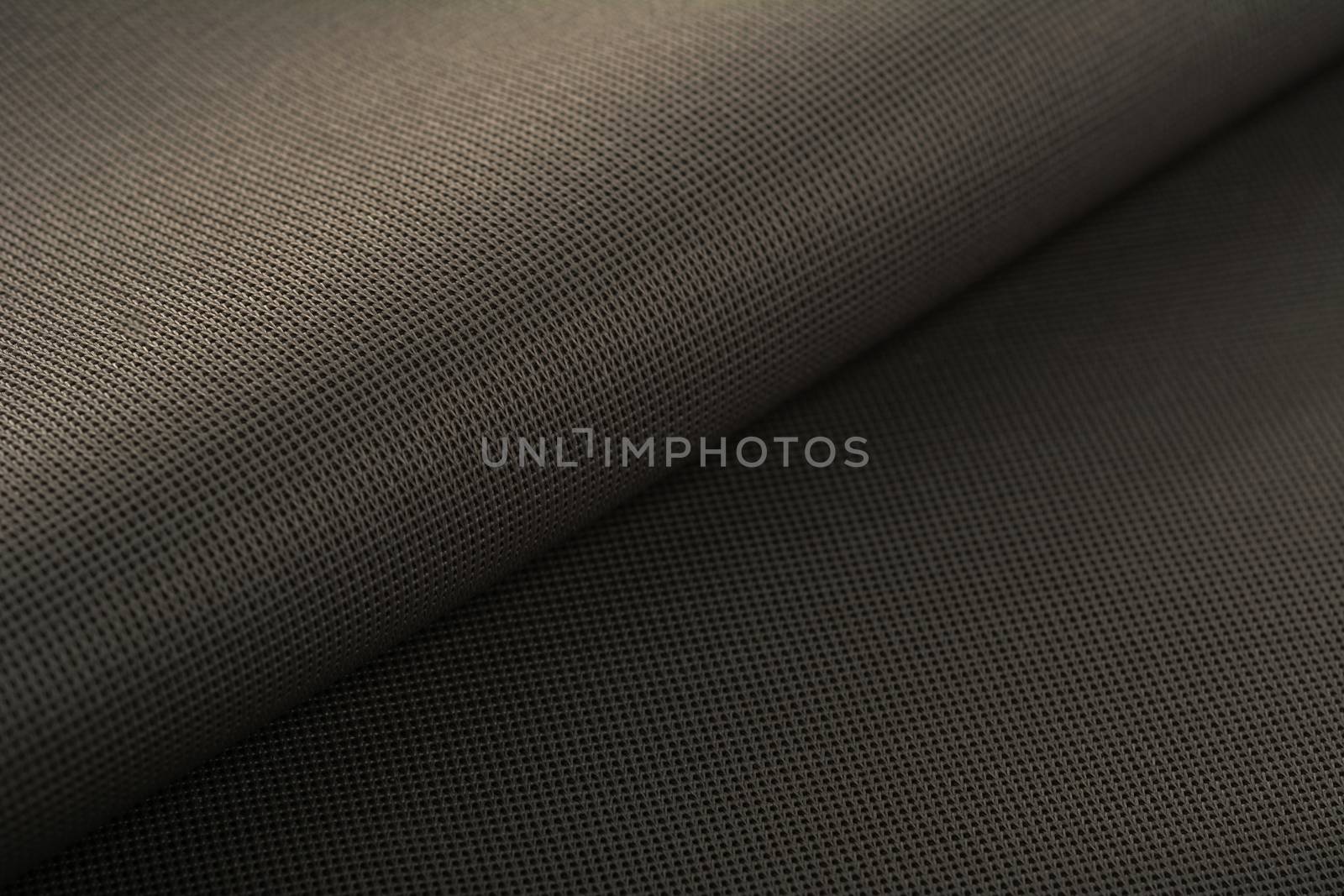 khaki Knitted elastic fabric, weaving of threads texture, crumpled fold. For underwear, sports clothes and swimwear. Space for text.