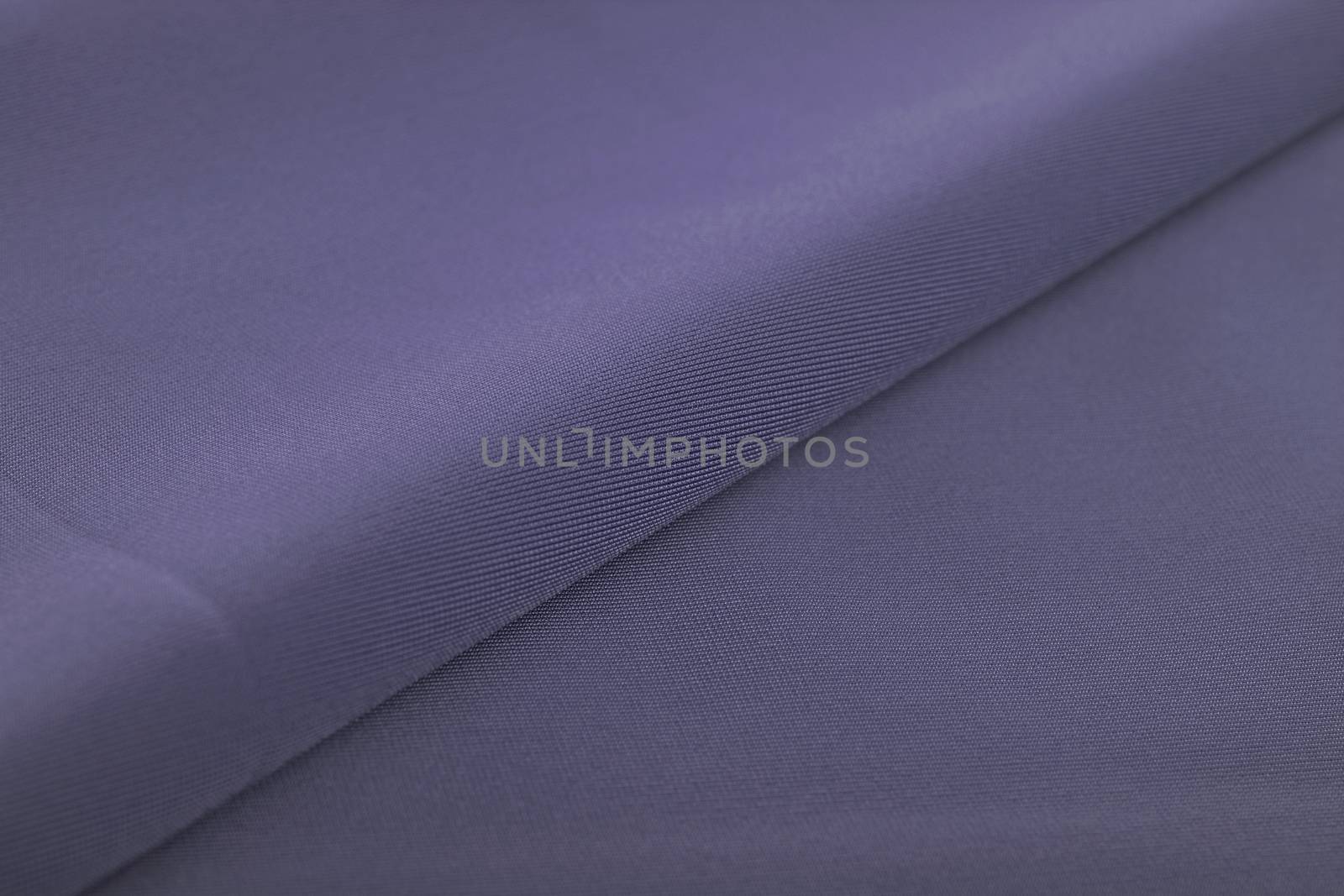 blue Knitted elastic fabric, weaving of threads texture, crumpled fold. For underwear, sports clothes and swimwear. Space for text.