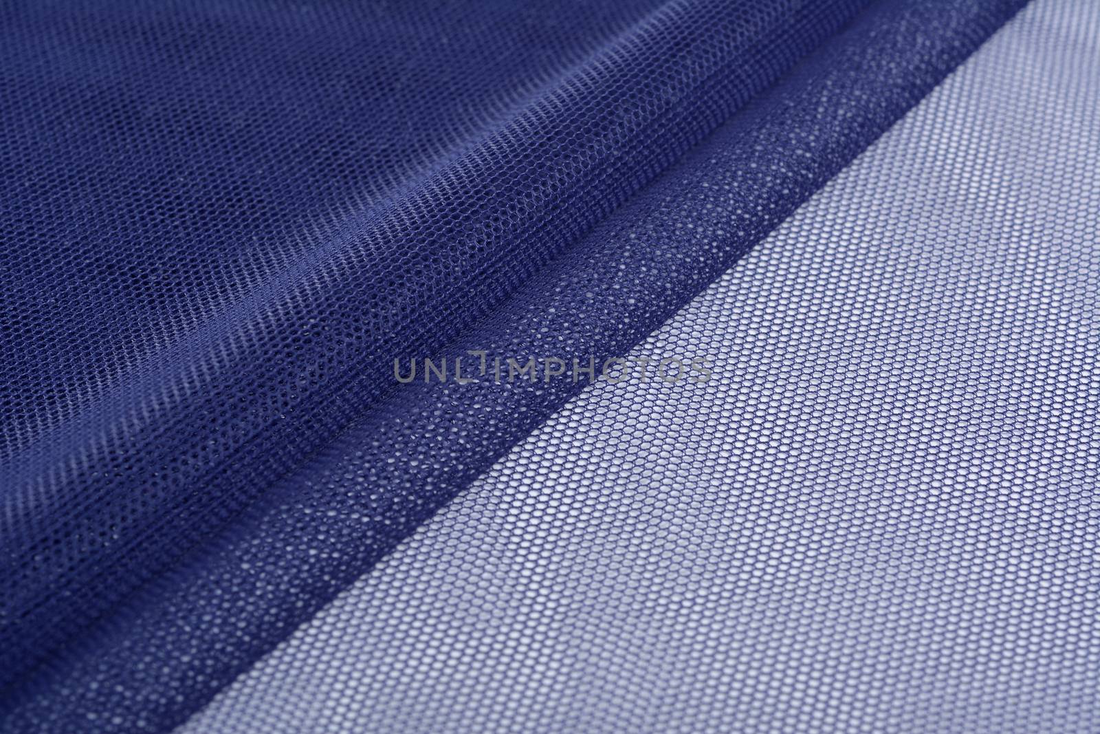 blue Knitted elastic fabric, weaving of threads texture, crumpled fold. For underwear, sports clothes and swimwear. Space for text.