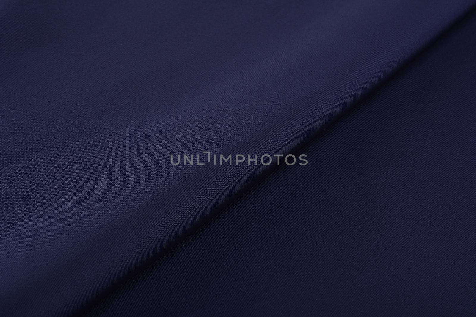 blue Knitted elastic fabric, weaving of threads texture, crumpled fold. For underwear, sports clothes and swimwear. Space for text.