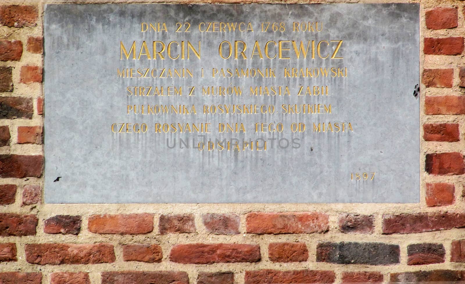 The memorial plaque on the wall of the Polish hero by Grommik