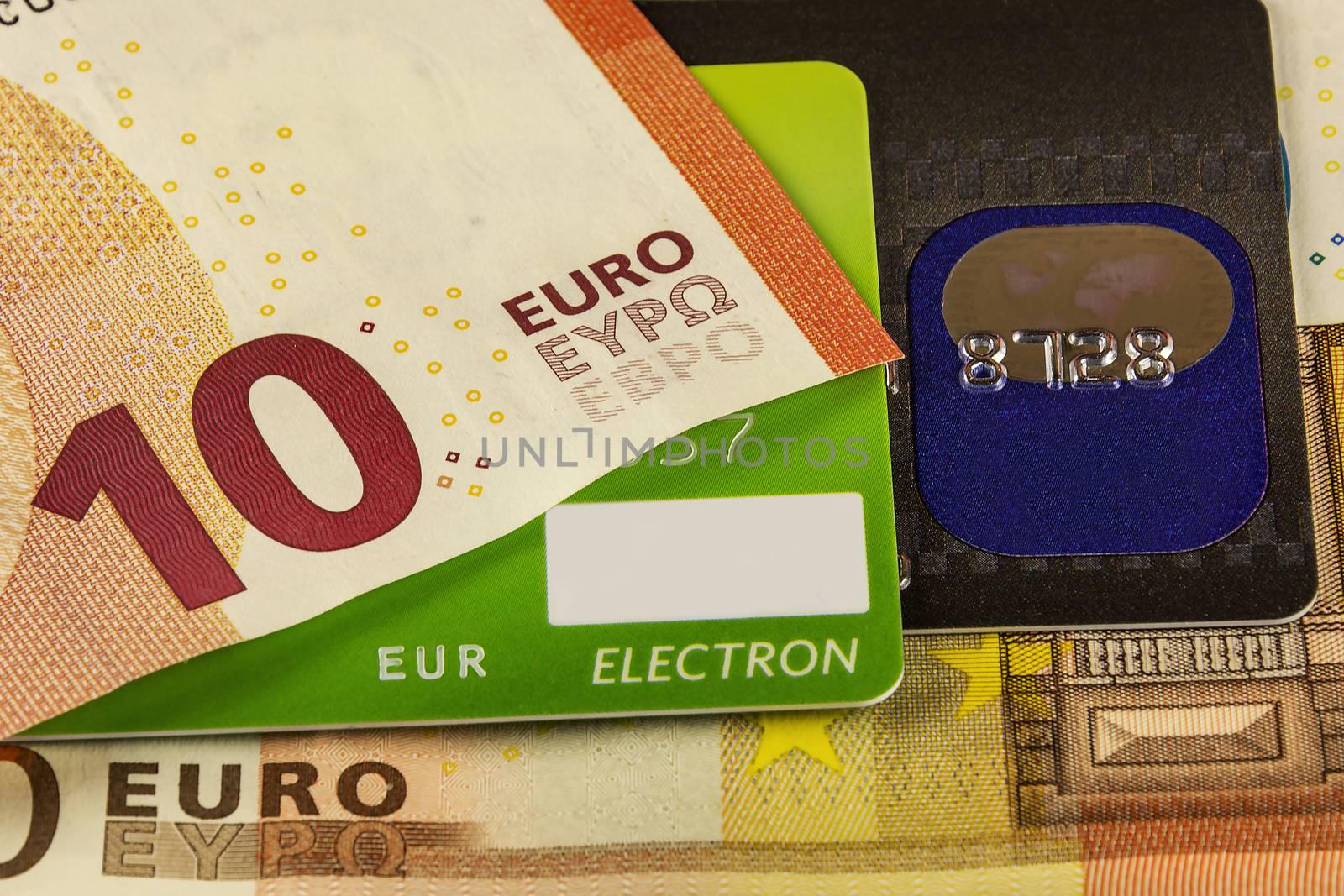 Part of the bank card and a part of the euro banknotes by Grommik