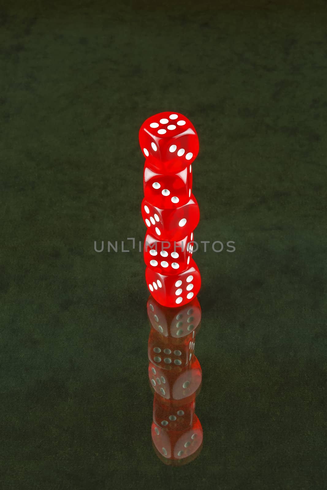 The glass surface reflects red dice poker by Grommik