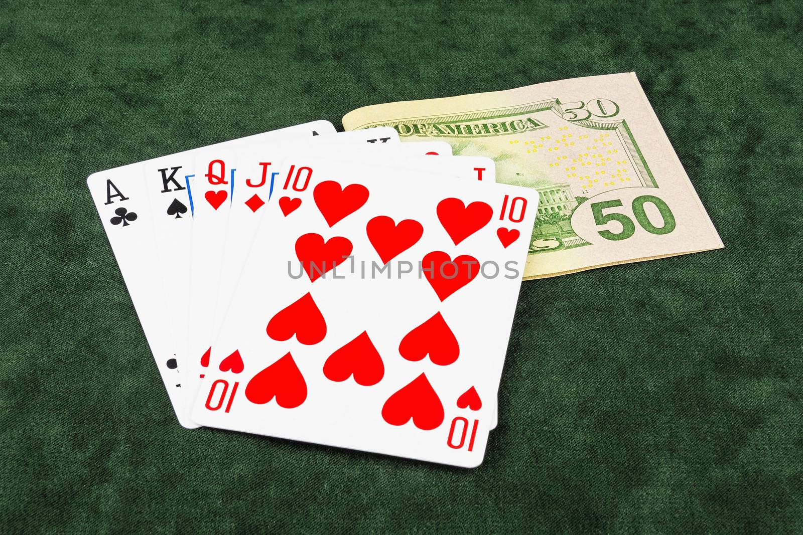 On the green baize poker is bet and five cards by Grommik