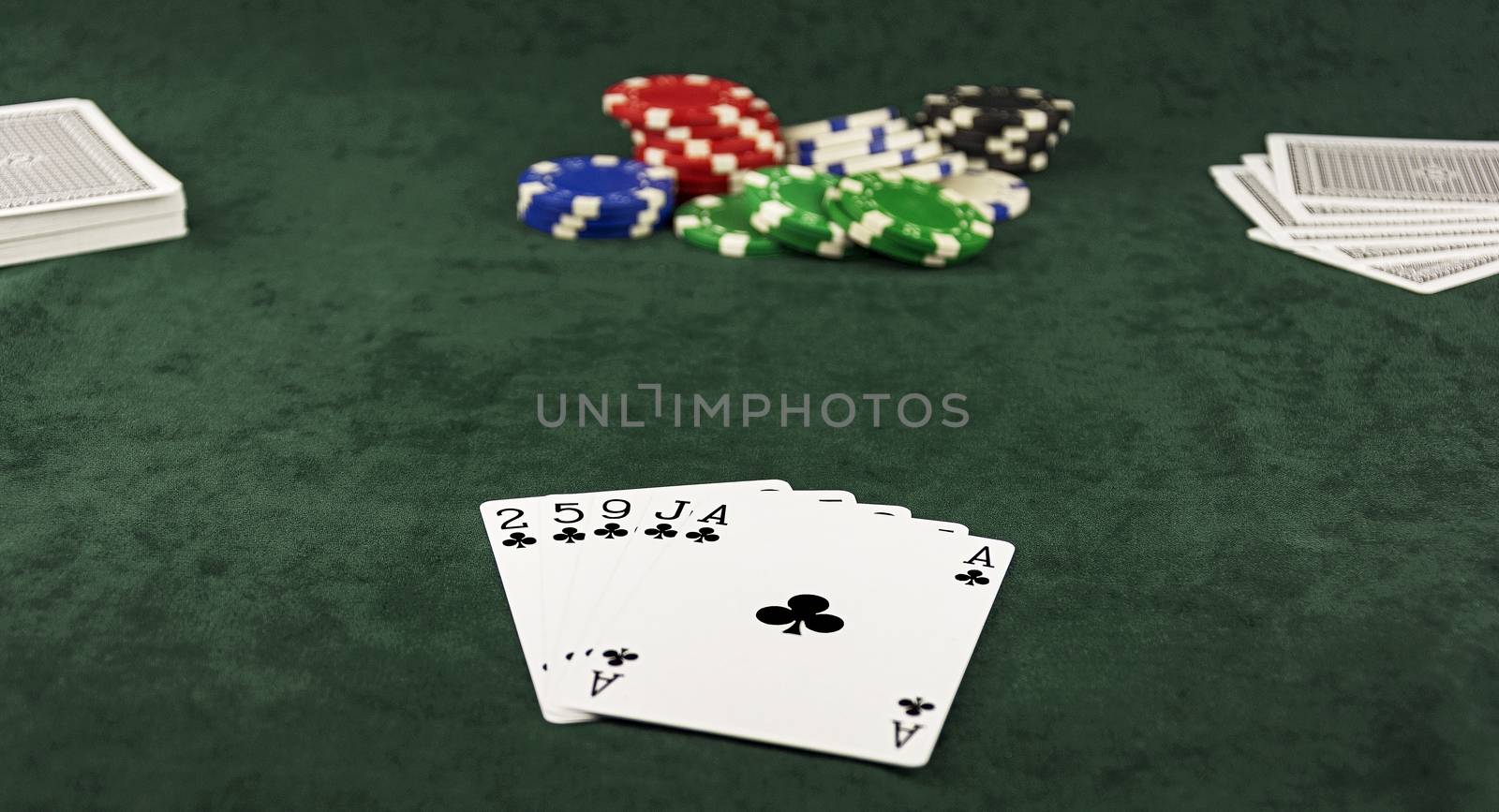 On the green baize Center pot and is five cards of the same suit