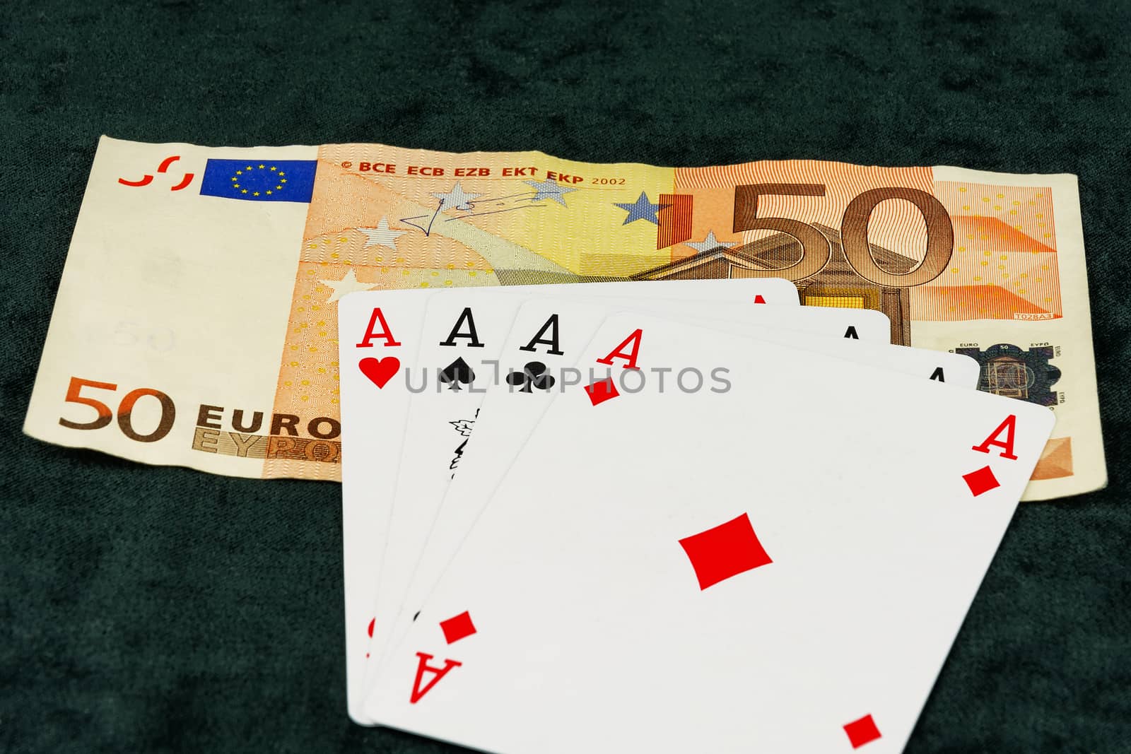 The combination of four aces lying on banknotes by Grommik